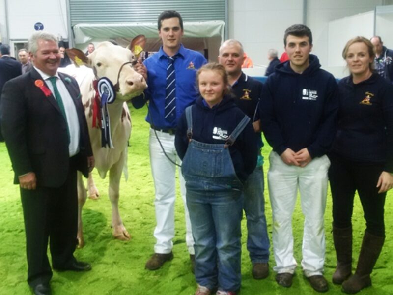 Judge - Selwyn Donald (left) with the Keenan family and their champion Ayrshire