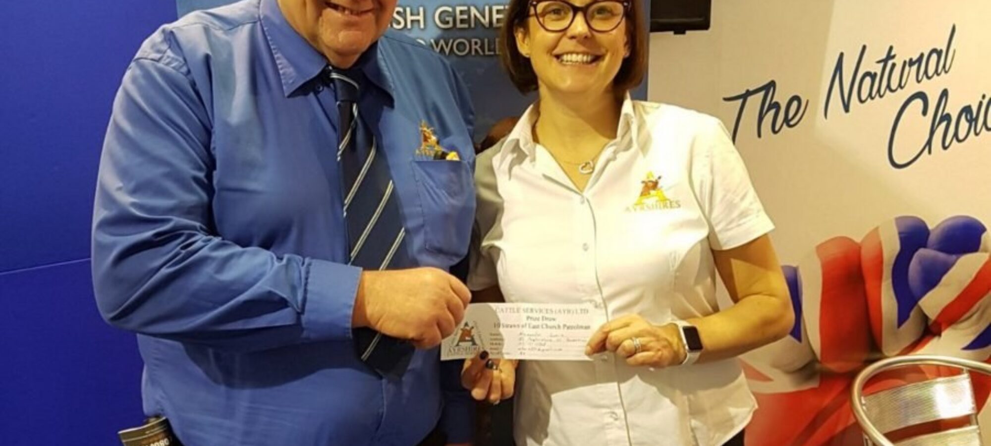 Pictured is Society President Philip Williams and Ayrshire General Manager Claire Kimm, with the winning entry from the prize draw.