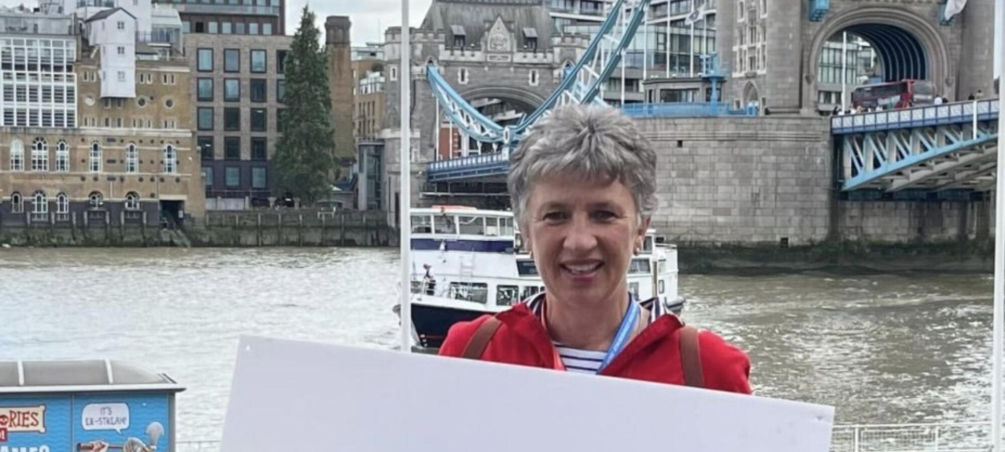 One of our wonderful bus couriers, Jane Barnes at Tower Bridge, London, the beginning of the tour.