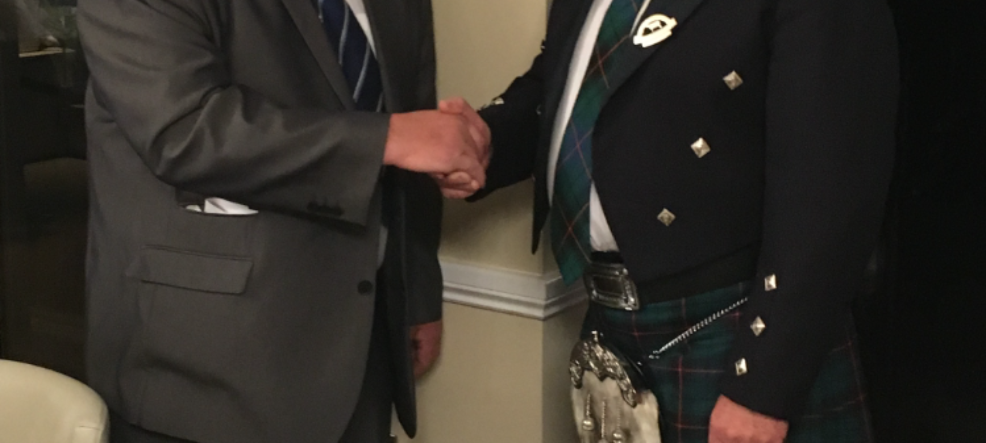 L to R Past President Philip Williams congratulates the new President Keith Davidson
