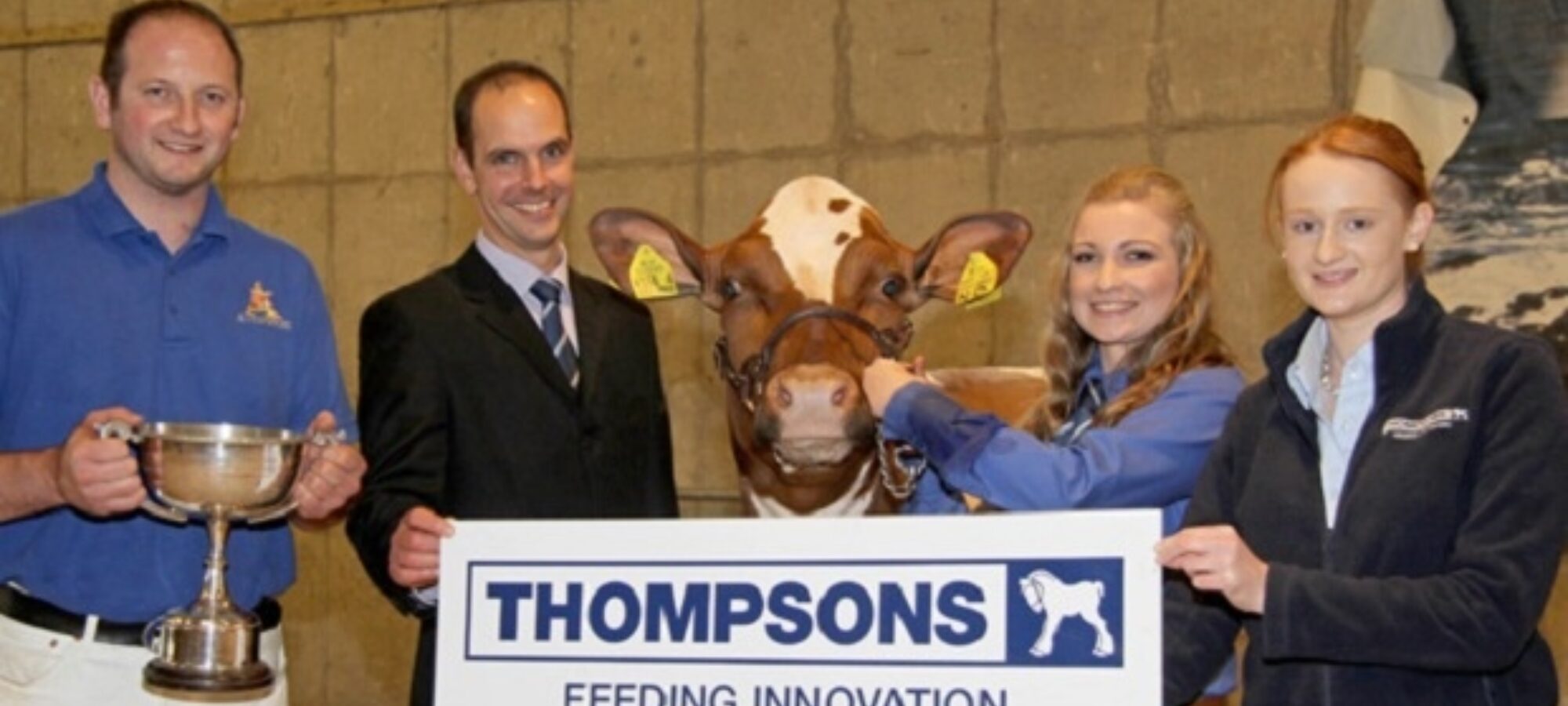 Michael Hunter, left, Crumlin, owned the Ayrshire champion Ardmore Orphan 117, exhibited by Sarah Jones. Adding their congratulations are judge Michael Broadley, Derbyshire; and sponsor Denise Rafferty, Thompsons.
