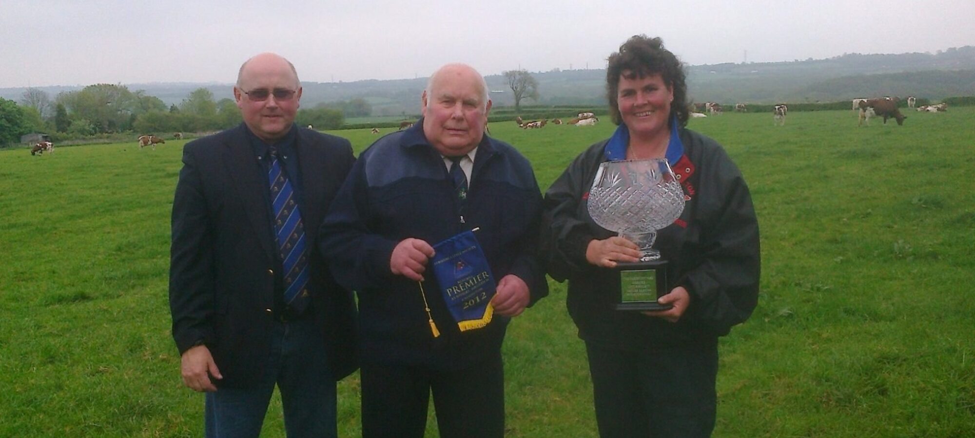 Right to left - Lisa Window-Walker and her late father Chris Window being presented with the Haresfoot Vase by Alan Timbrell
