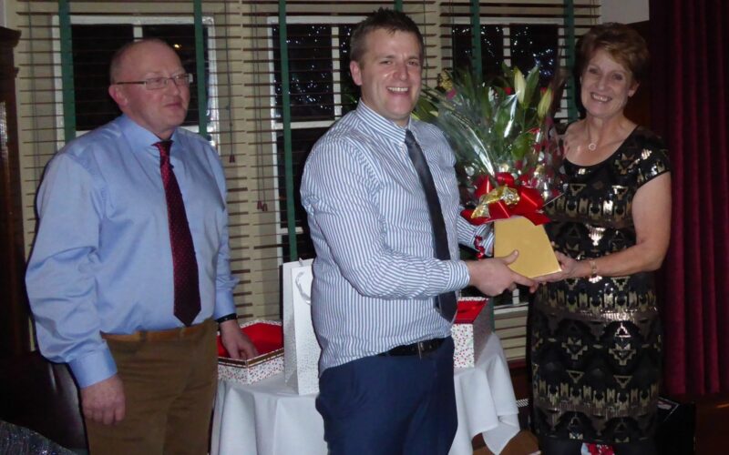 Nancy receives flowers, presented by Sam Wake