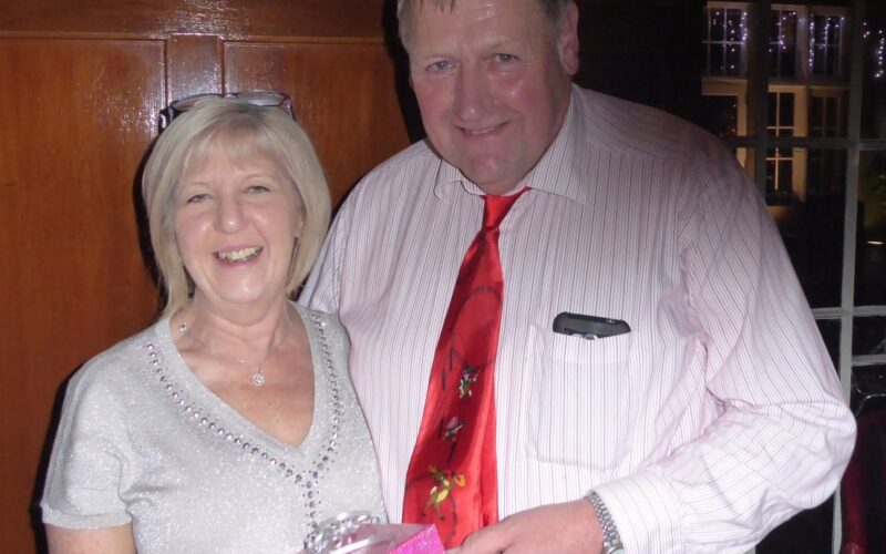 President Philip Williams presenting Lesley with a gift to recognise her service.