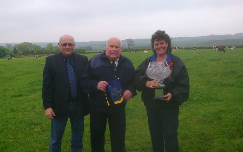 Right to left - Lisa Window-Walker and her late father Chris Window being presented with the Haresfoot Vase by Alan Timbrell