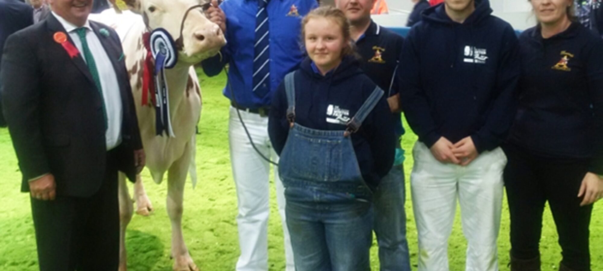 Judge - Selwyn Donald (left) with the Keenan family and their champion Ayrshire